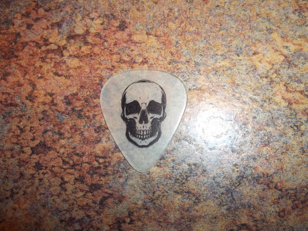 Guitar Pick Medium Celluloid - Glow Skull - Black on Glow Plastic